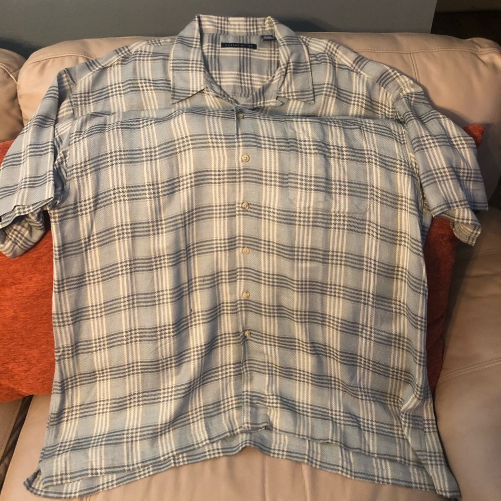 Selling a green flannel with black, white stripes.